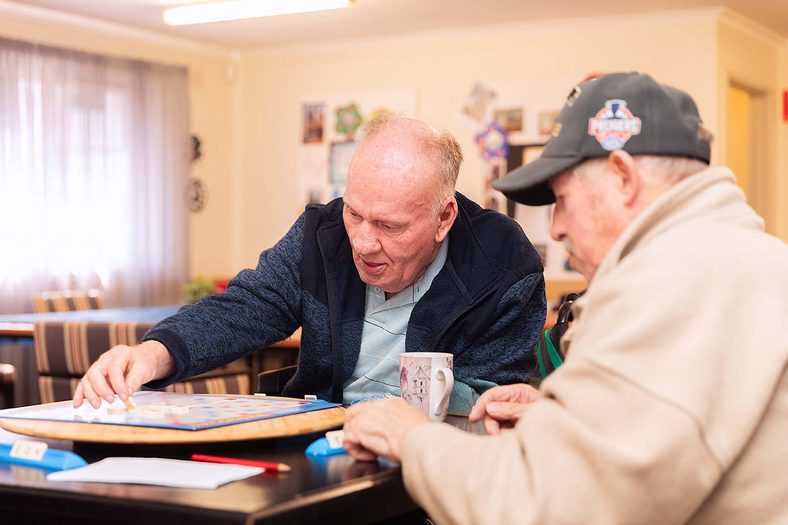 Two men playing scrabble.