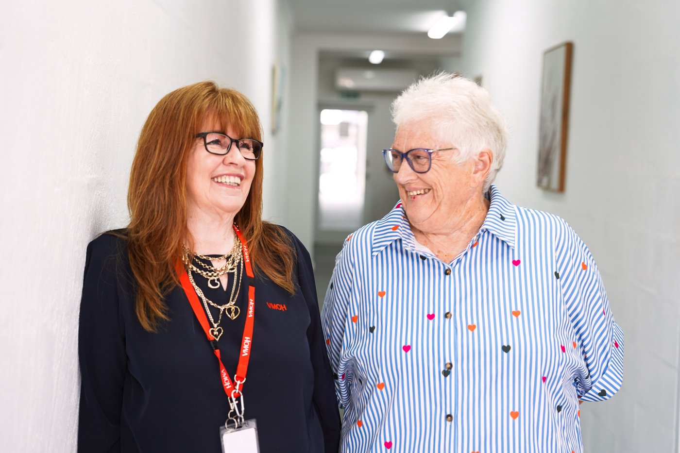 Two women chatting and laughing.
