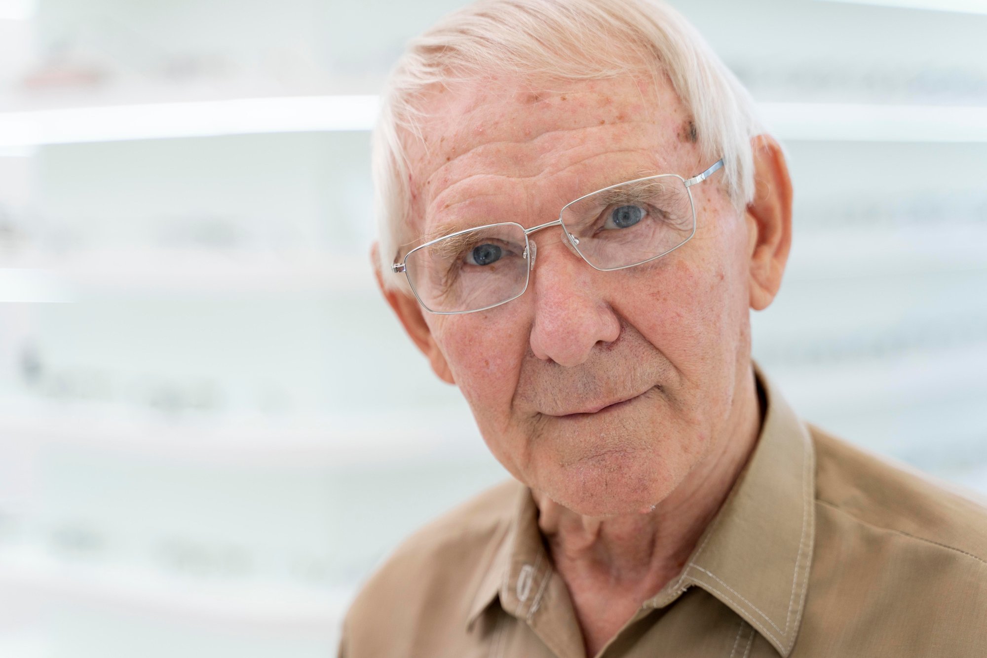 An older man wearing a pair of glasses.